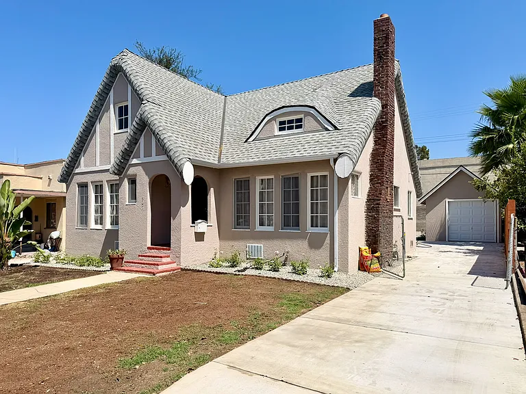 Front from new driveway. Lawn just reseeded.