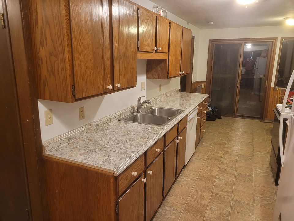 Sink, counter and cabinets looking toward dining room