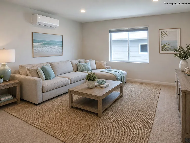 Upper loft area with mini-split for air conditioning, virtually staged.