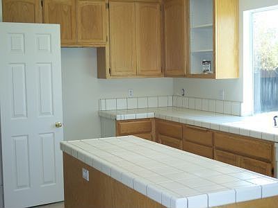 Kitchen with island and built-in pantry
