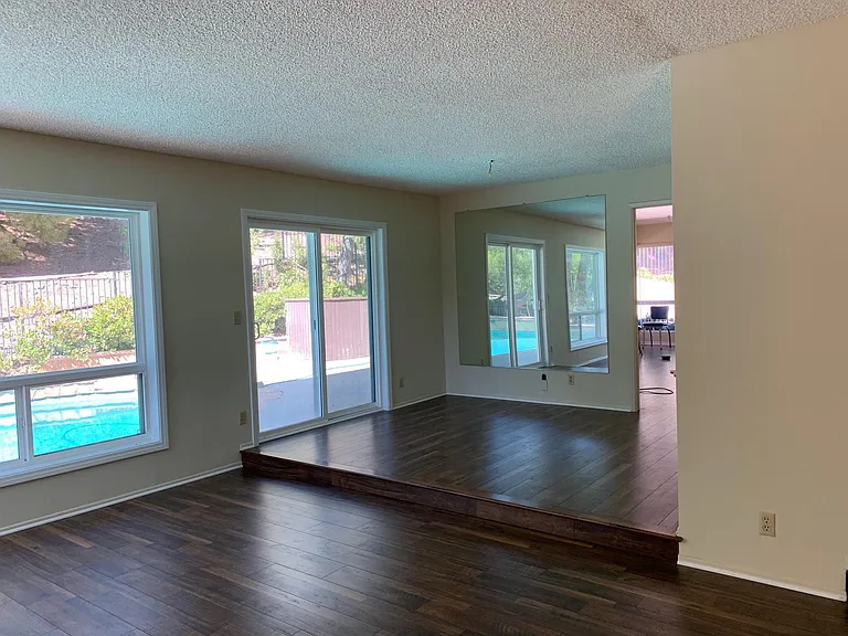 Dining room sits between living room and kitchen with access to the pool and patio allows great flow for entertaining.