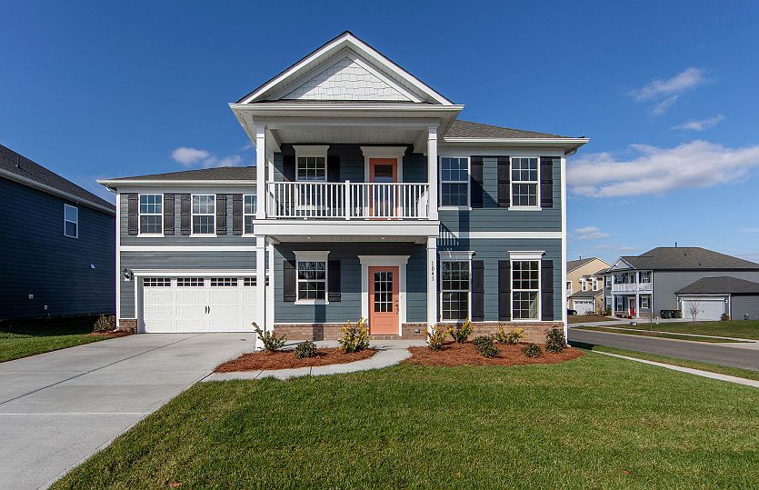 Foxfield Exterior 5 w siding, shakes, brick, double front porch deck and 2 car garage