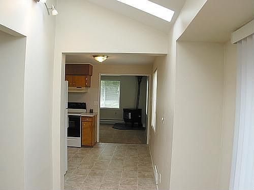 From the living room to the dining room...open and bright here with skylights