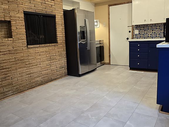 Generous lighting. New fridge with icemaker and new electric range.