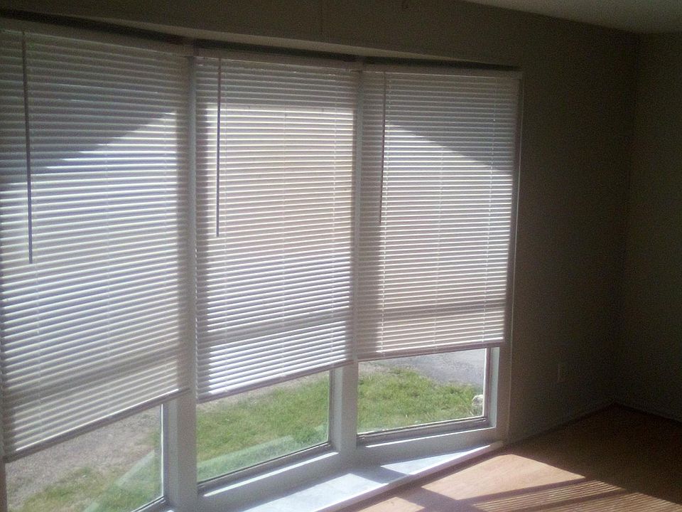 Front room with floor to ceiling windows