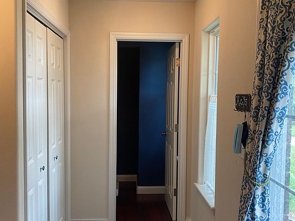 closet and bathroom inside the front door