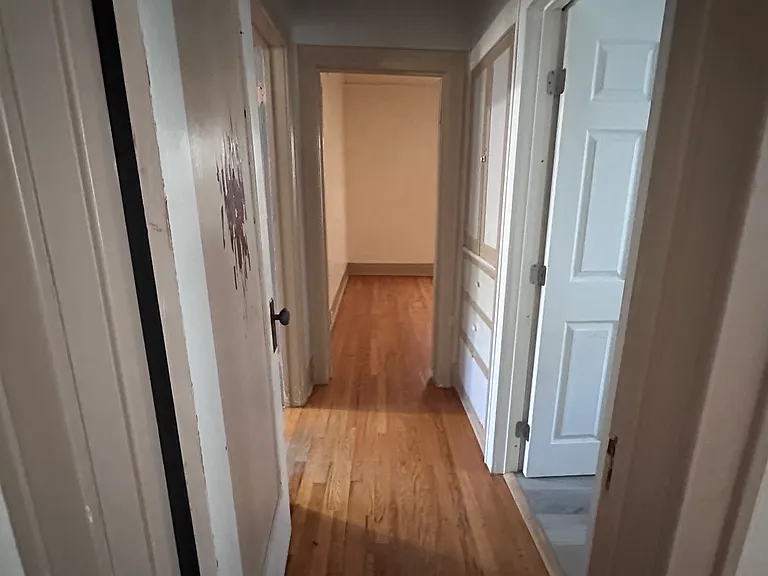Hallway view between both bedrooms. View from Living Room.