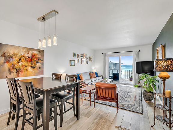 Open concept dining and living area with bay views.