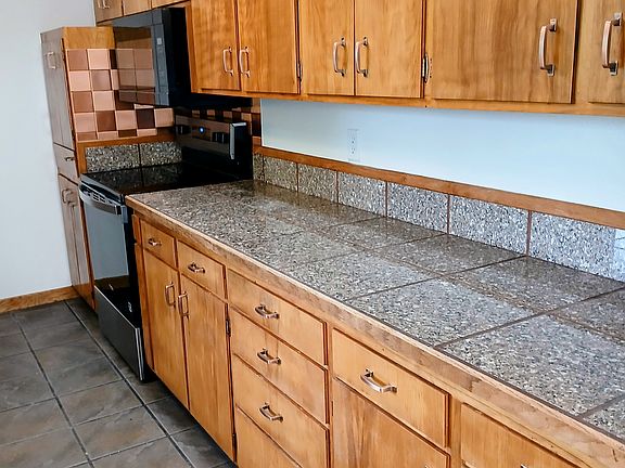 View of cabinets and stove area