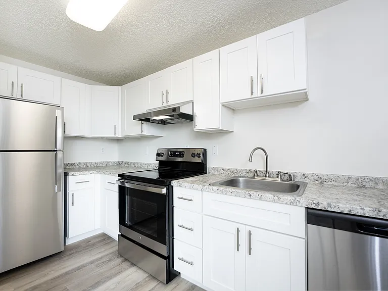 Modern Tacoma apartment kitchen with upgraded finishes and stainless appliances. Modern Tacoma apartment kitchen with upgraded finishes and stainless appliances.