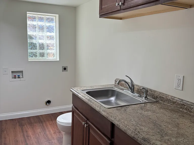 Laundry room with toilet