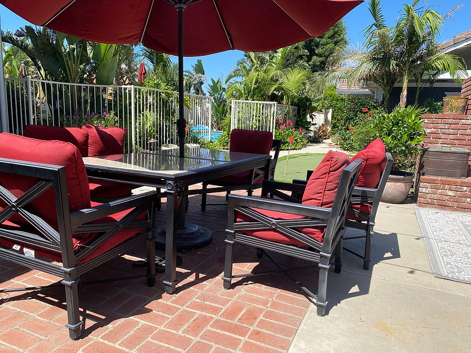 Gather with family and friends for al fresco dining in the inviting backyard setting.