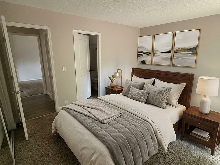 A different view of the main floor master, showing access to the bathroom and hallway