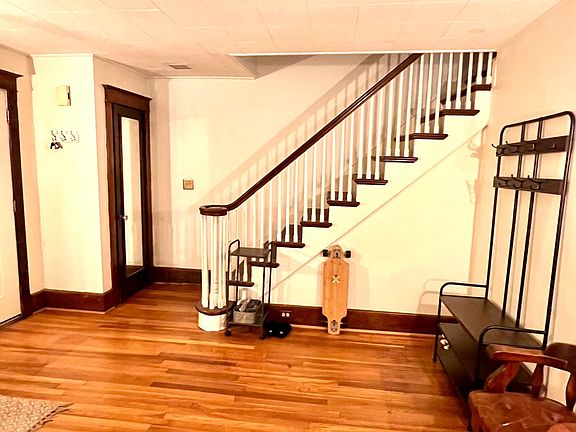 Living room with closet and mirror