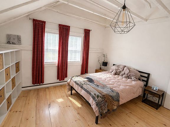 Bedroom 2, with high ceilings, creating a spacious, open feel.