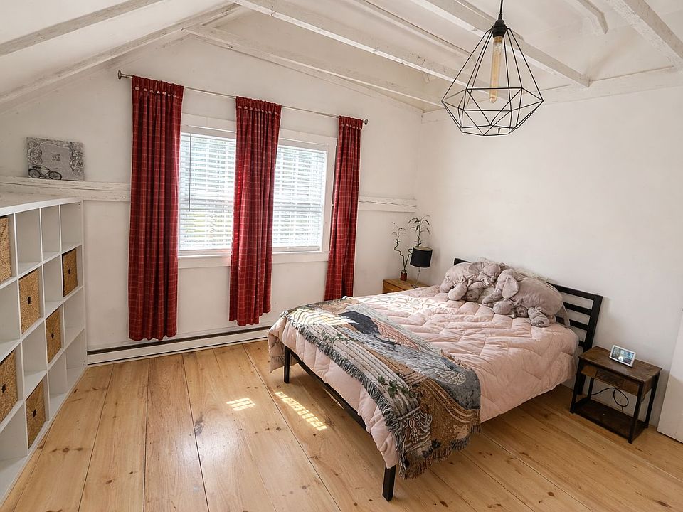 Bedroom 2, with high ceilings, creating a spacious, open feel.