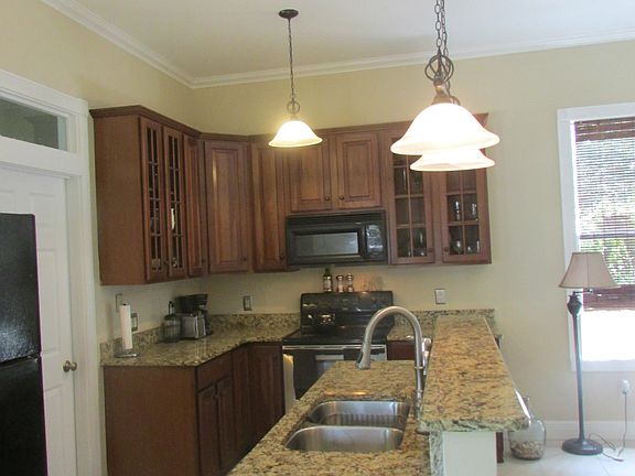 CHERRY CABINETRY & GRANITE