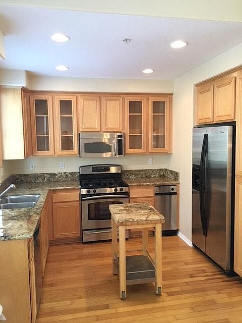 Kitchen w granite and stainless steel appliances
