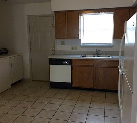 Range, dishwasher, refrigerator, washer and dryer included.