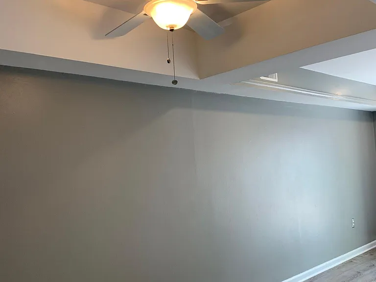 Dining room space with ceiling fan.