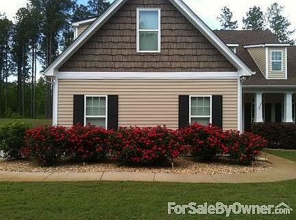 Front
						:
						Knockout roses. River rock beds
