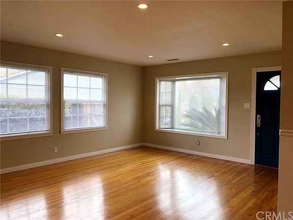 Gleaming Wood Floors, Recessed Lights & Freshly Painted Throughout.