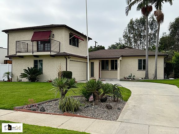 Newly painted exterior, new porch, new garage door, new electrical/plumbing, 10k sq. ft lot.