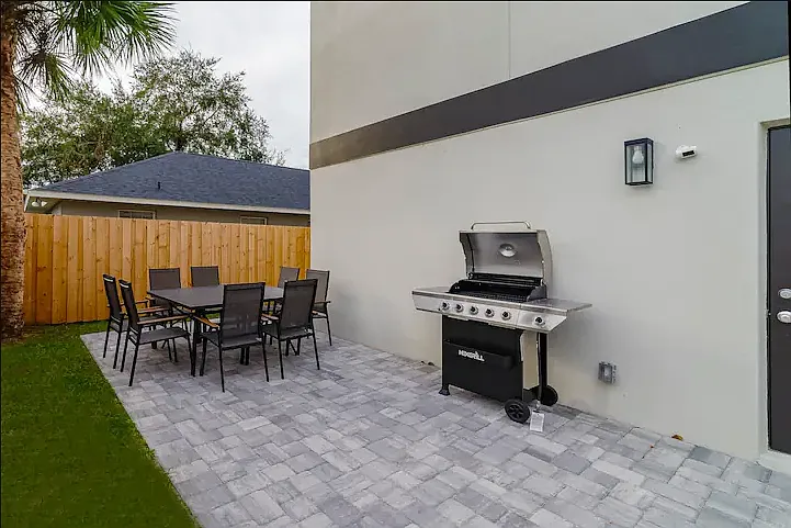 Gather around the outdoor dining area and enjoy a fresh grilled meal.