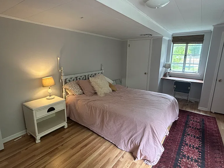 lower level bedroom, queen bed pictured.