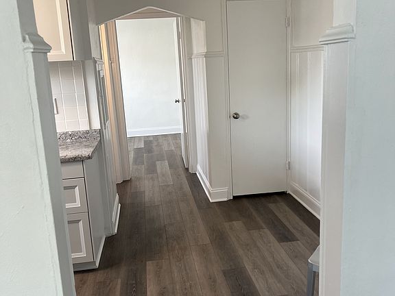 view from family room to kitchen on way to bath and bedroom