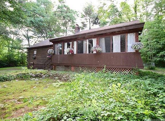 An enclosed front porch ove...