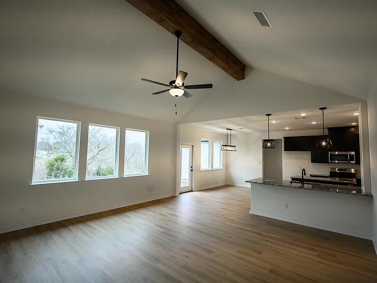 Open Concept Family Room looking into Dining and Kitchen