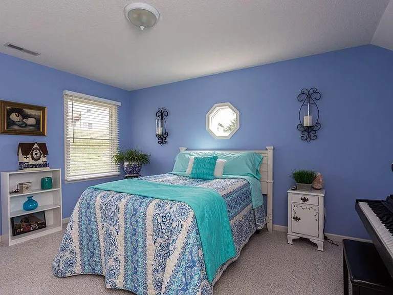 Queen bed gives sense of spaciousness. 
this room empty is shown next