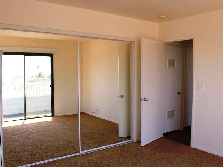 Bedroom with mirrored closet