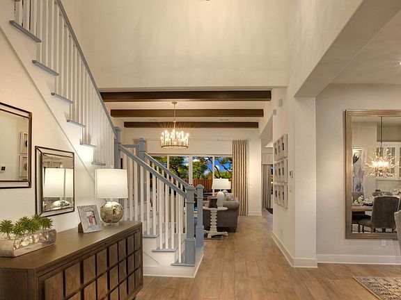 Two-story foyer with hardwood floor
