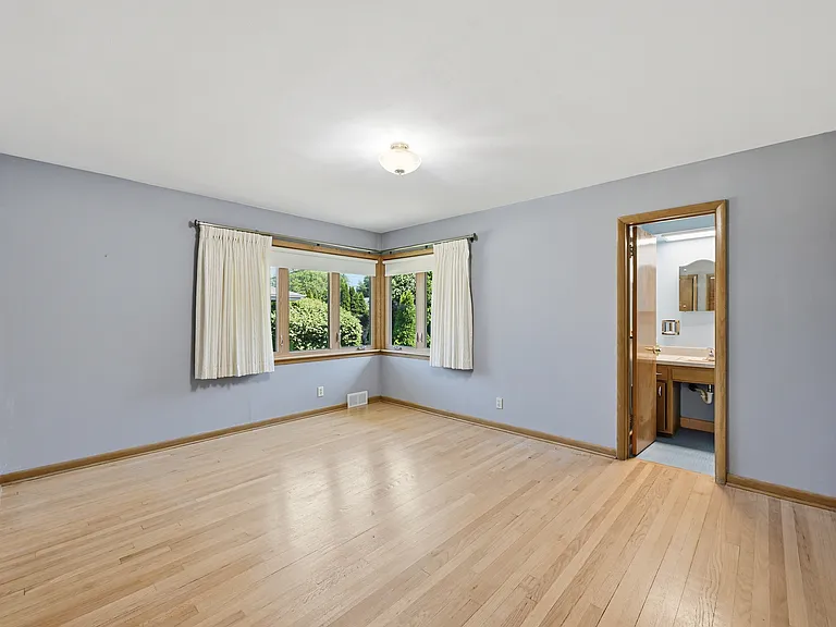 Primary Bedroom with attached half-bath