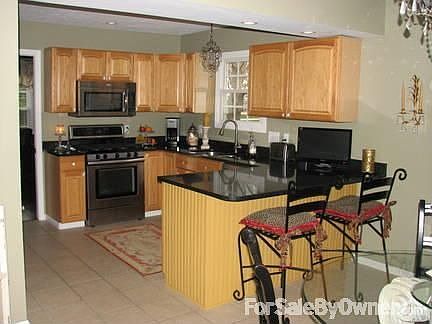 Kitchen with breakfast bar
						:
						Also includes dining area (not pictured)