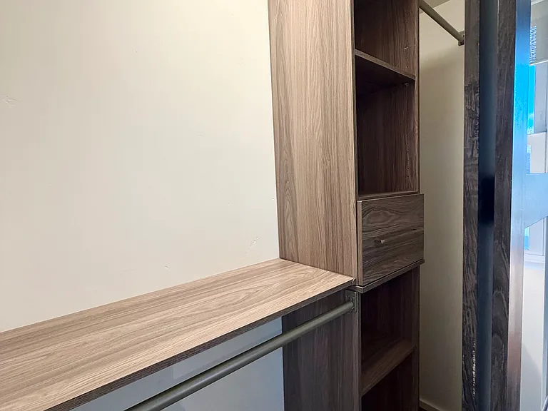 Bedroom closet storage with lighting- 3 handing bars and built in cabinets