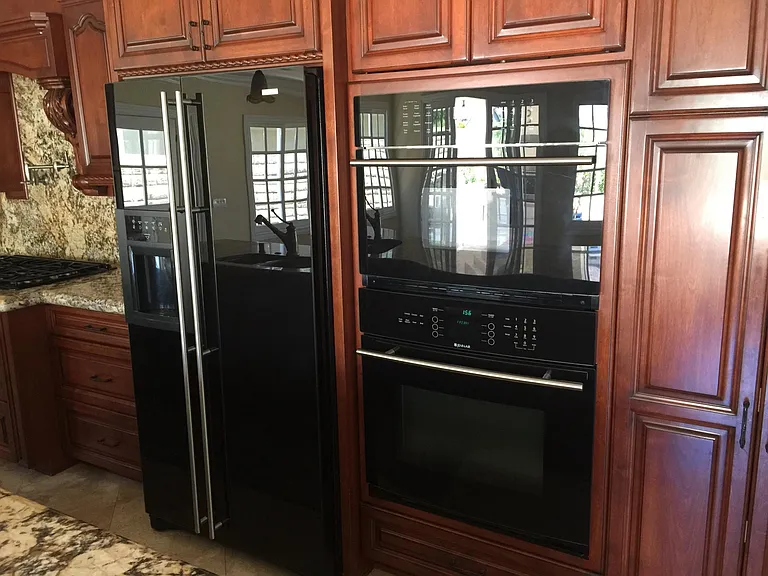 Custom cabinets, refrigertor & oven.