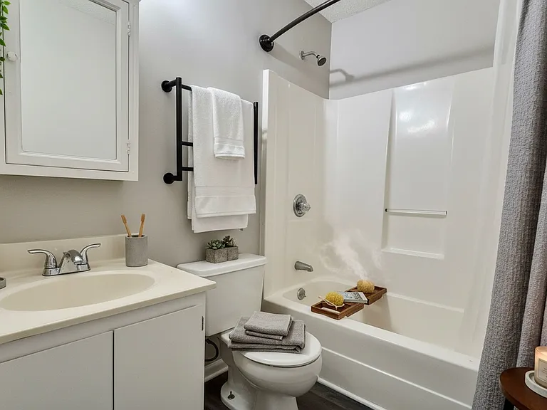 Spacious full bathroom with a simple, practical design.