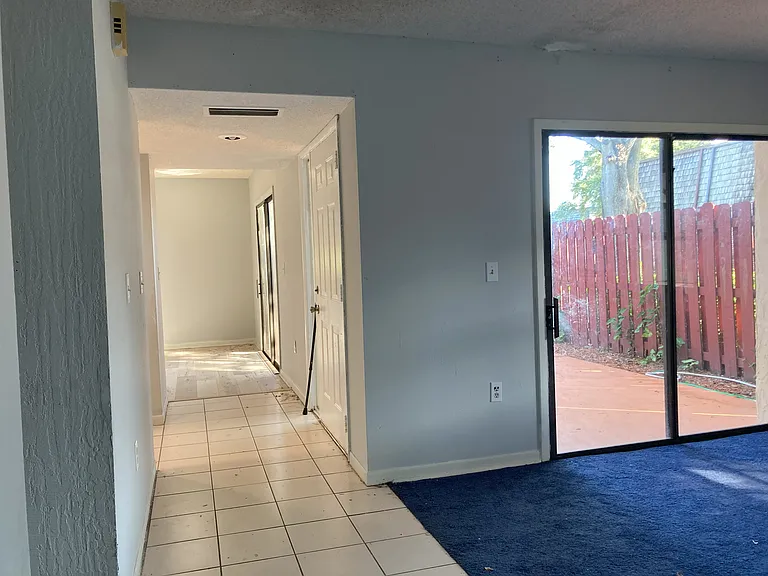 living room view to patio and dining room