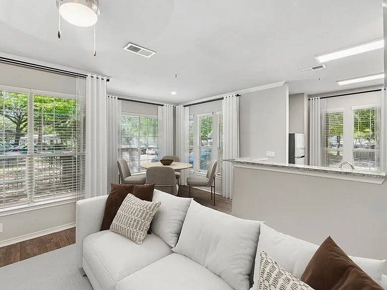 Classic Package II living and dining area with hard surface flooring (select homes)