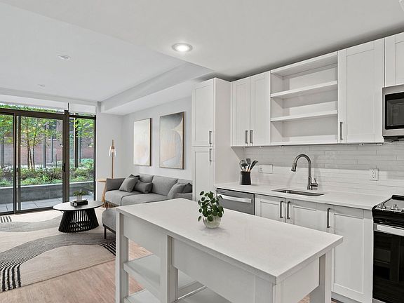 Kitchens equipped with quartz countertops, French door refrigerators, and a large kitchen island will encourage you to whip up your favorite meals