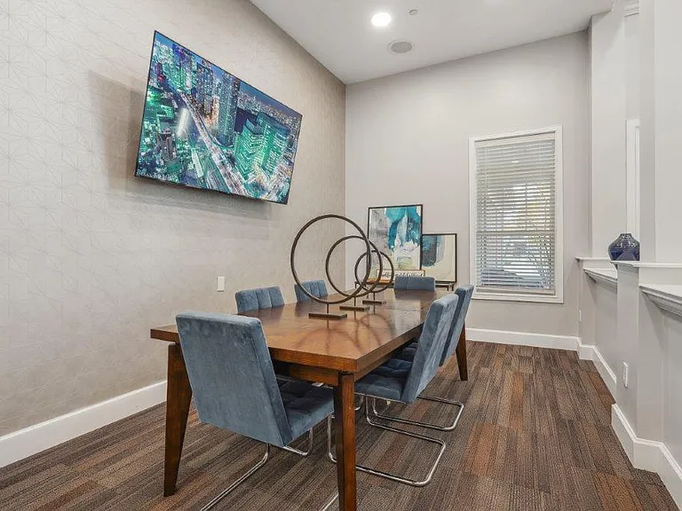 Gather for meals and conversation in a welcoming community dining space.