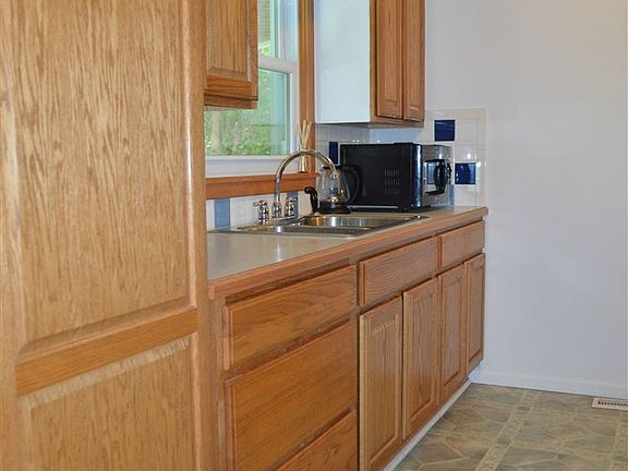 Updated kitchen with large pantry and new garbage disposal.