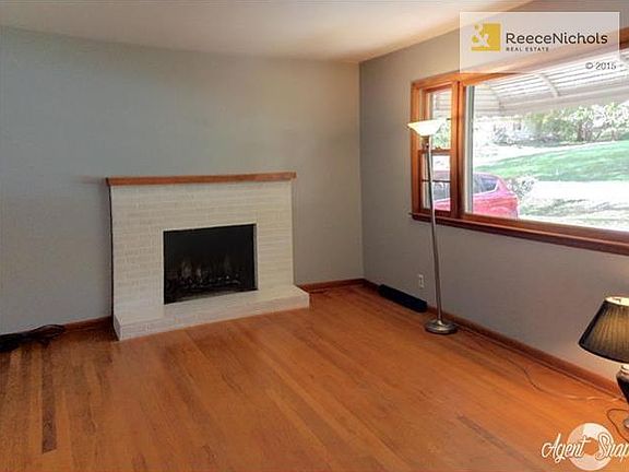 Fireplace and hardwood floors in living room.
