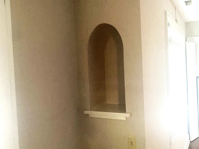 Cut-out in living room wall. Unusual perk. It was the owner's apartment when originally built.
