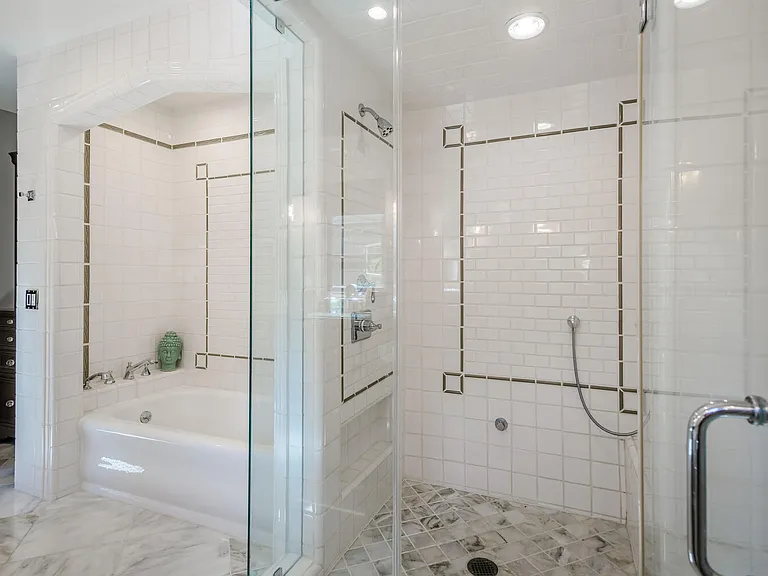 Primary bathroom with separate cast iron original bathtub