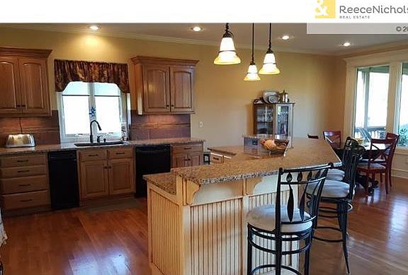 Island Kitchen with Breakfast Area overlook screened in porch & Deck
