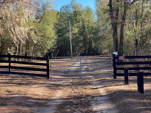 <p>Locked gate and cameras secure the entry</p>